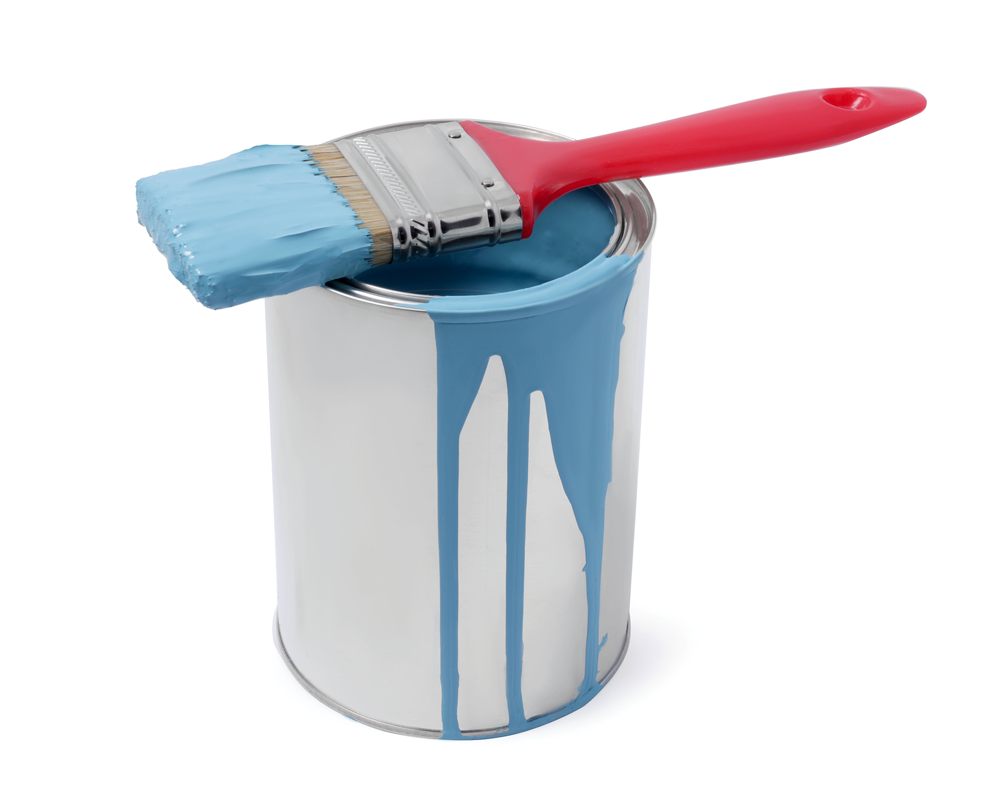 a paintbrush on top of a can of blue paint