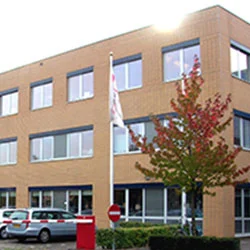 a building with a flag in front of it