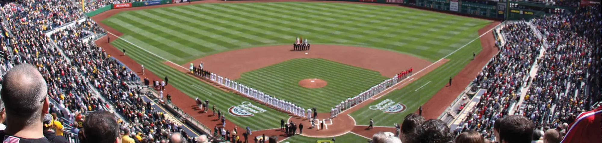 a group of people standing on a diamond