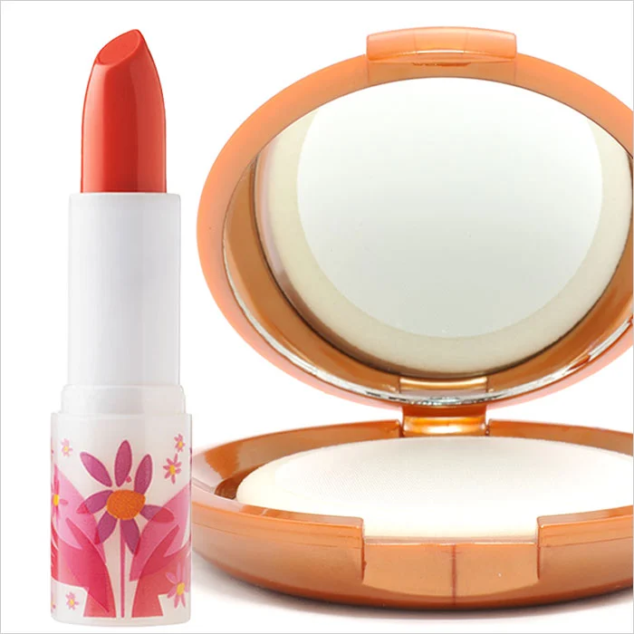 a lipstick next to a mirror