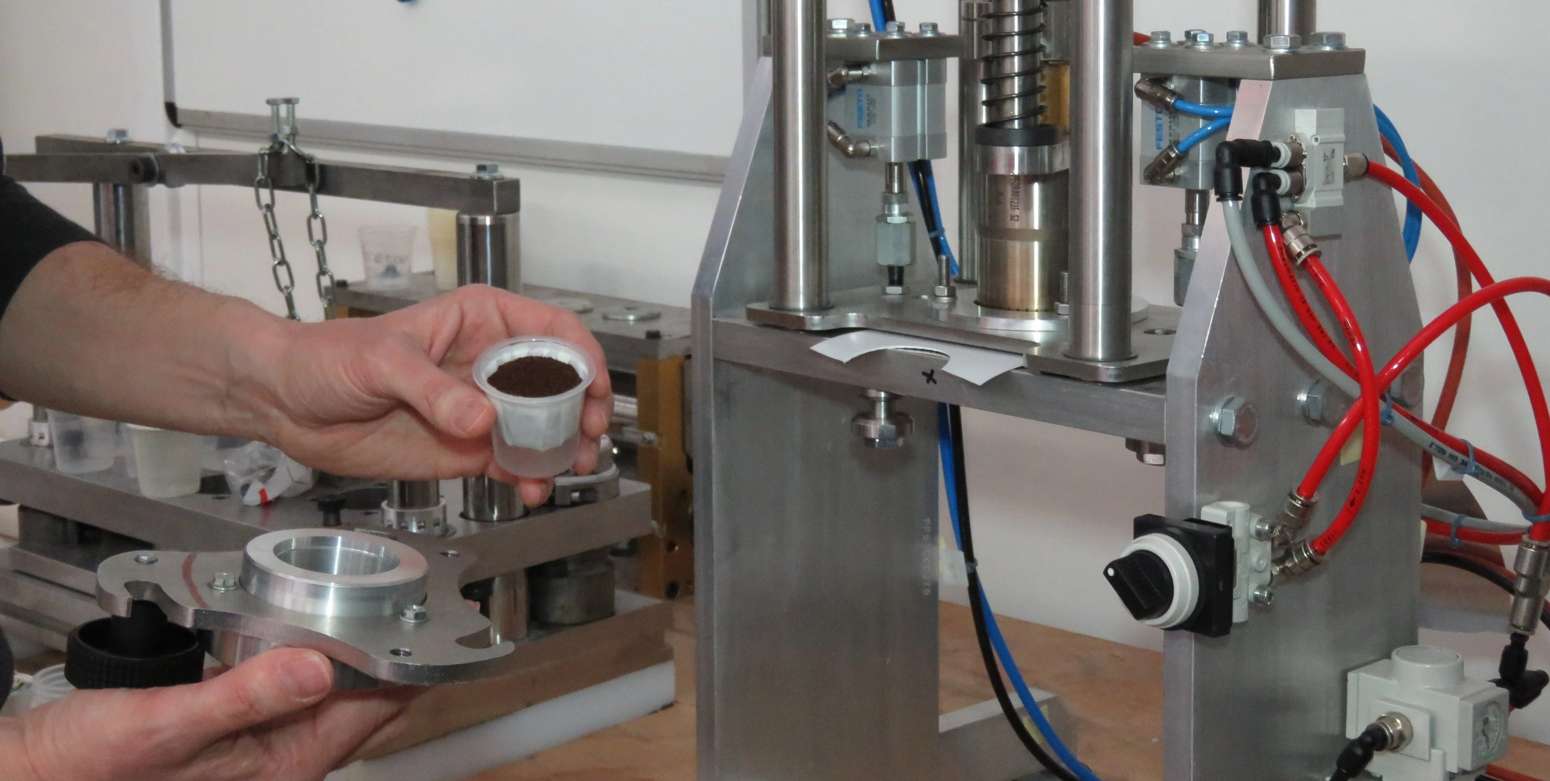a hand holding a cup of coffee