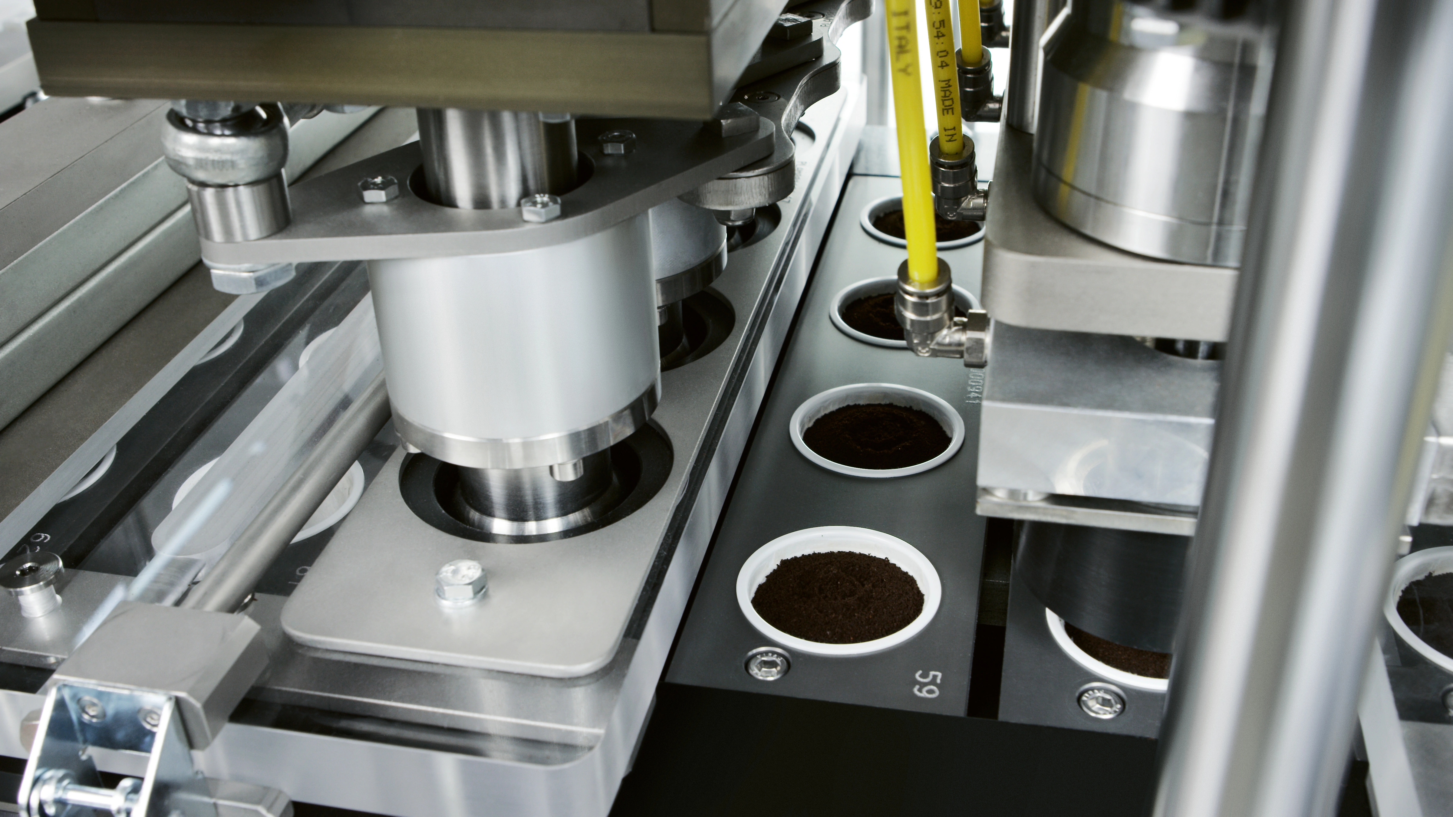 a machine with cups of coffee