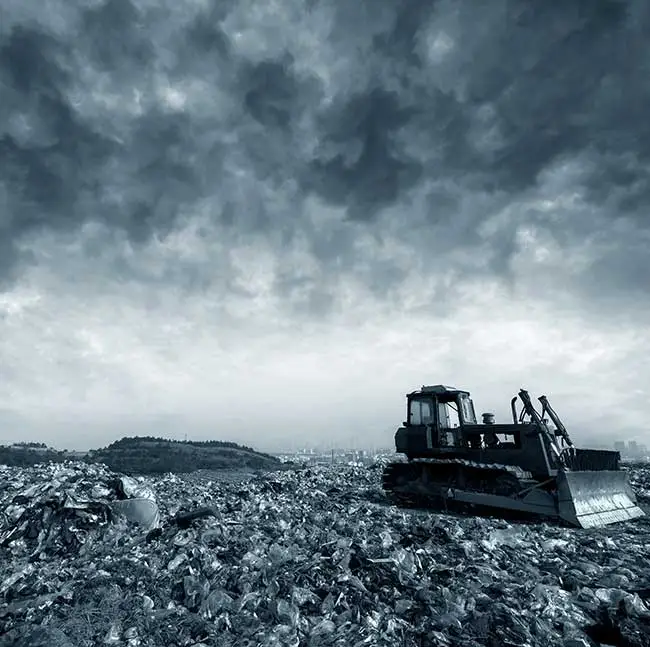 a bulldozer in a landfill