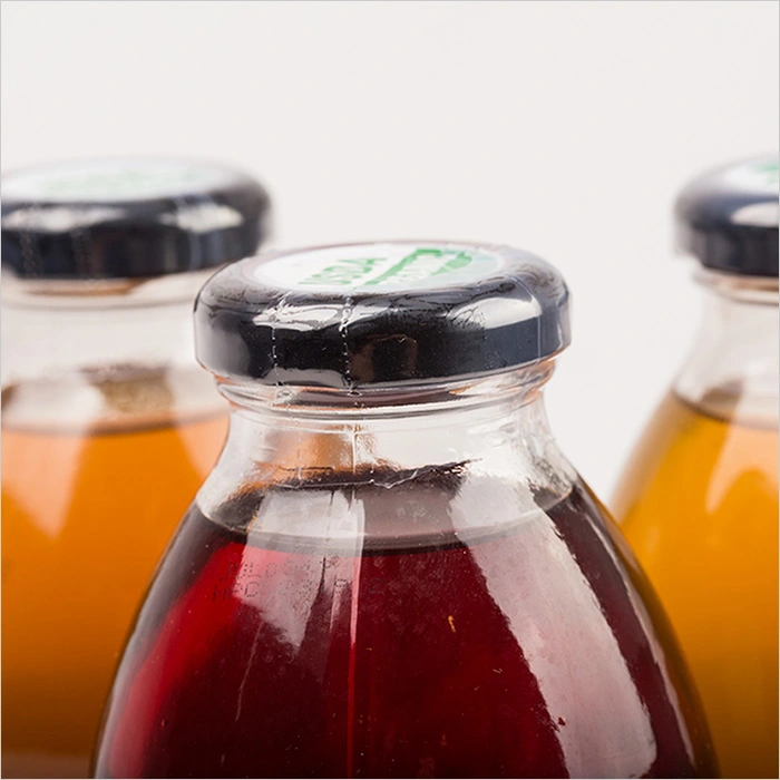 a group of bottles with different colored liquid