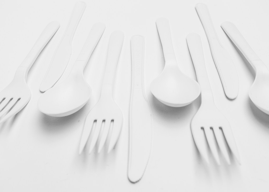 a group of plastic spoons and forks