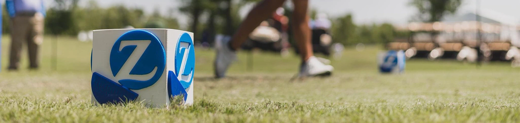 a person's legs in a grassy area