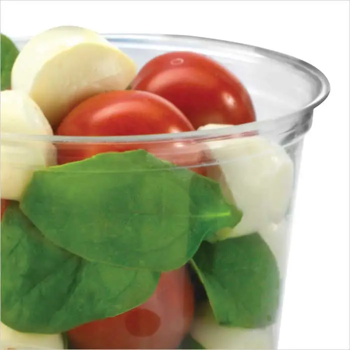 a bowl of vegetables and cheese