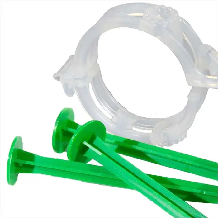 a close up of green plastic pegs