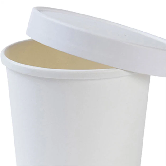 a white cup with a lid