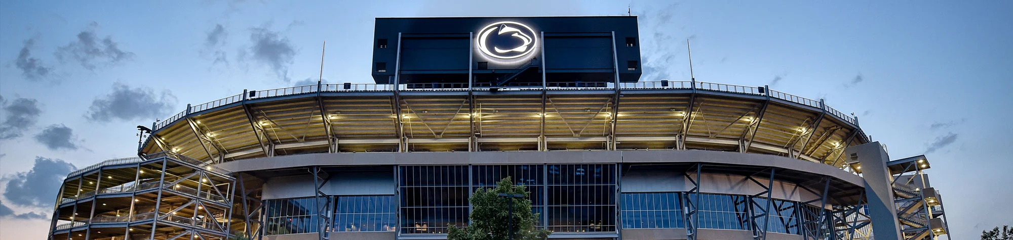 a large stadium with a logo on the side