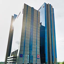 a tall building with blue glass