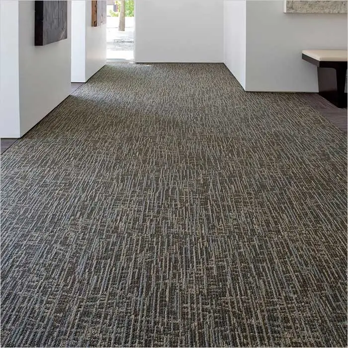 a carpeted room with white walls